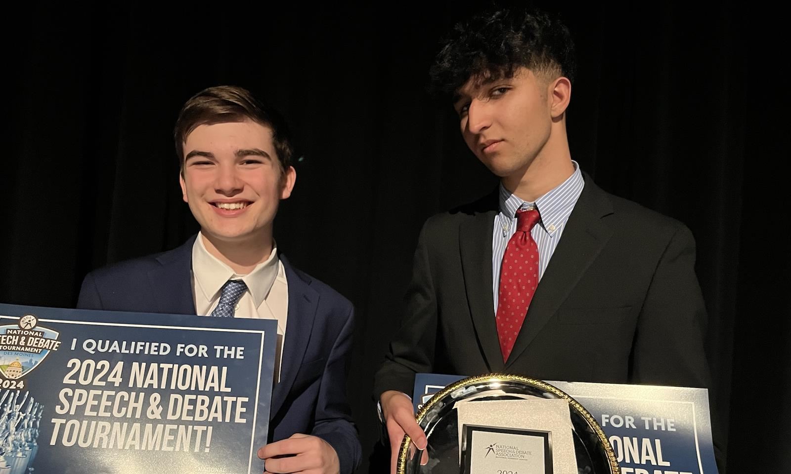 Two boys smile